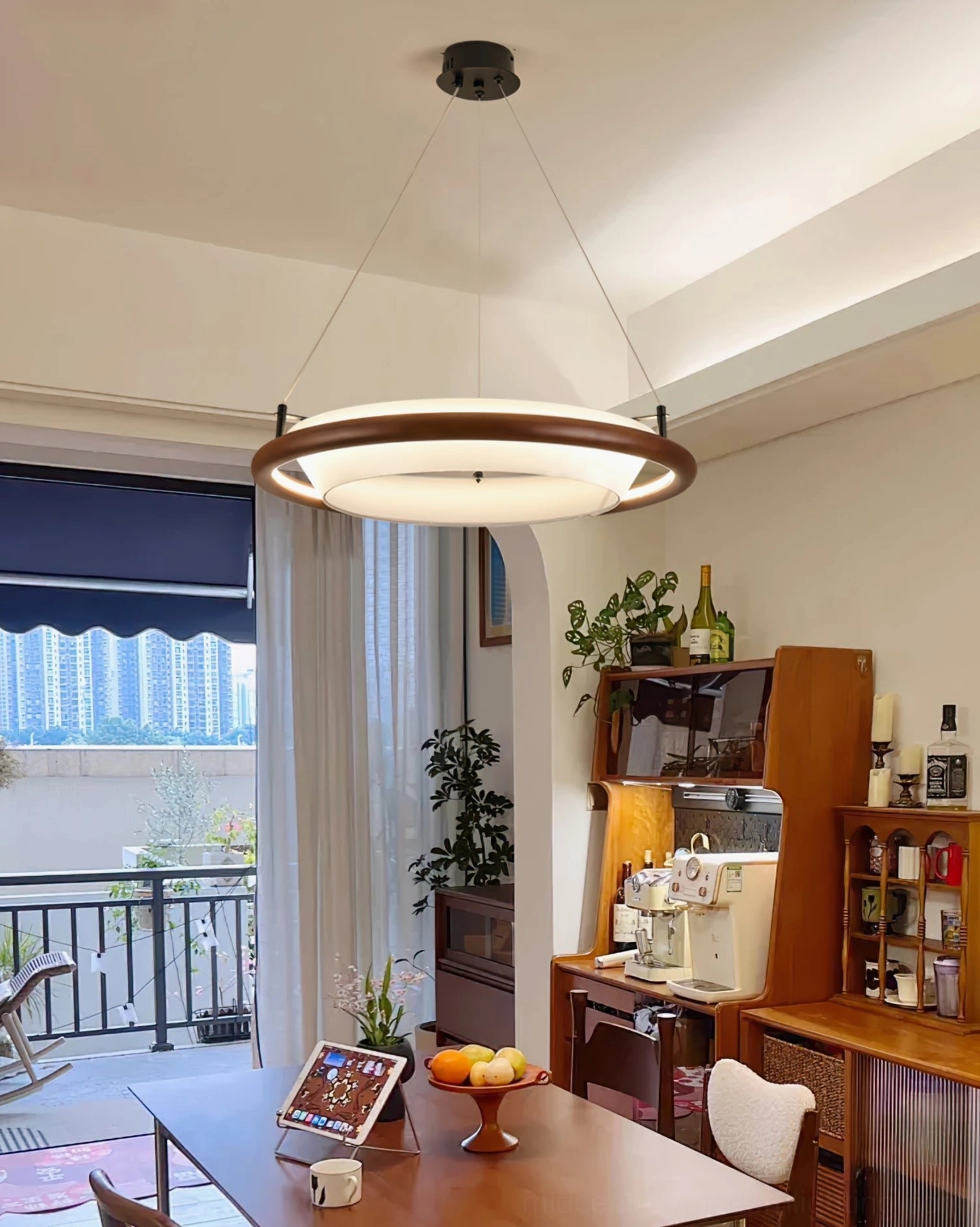 Azria walnut wood chandelier in home bar study area - interior view with balcony showing dark wood finish and rustic-warm styling