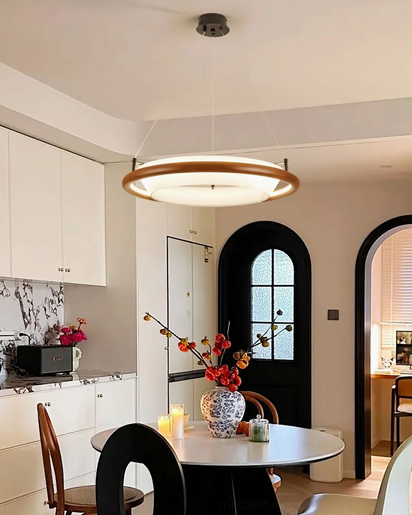 Azria LED ring light in contemporary kitchen - wide room view showing fixture above dining area with transitional design aesthetic