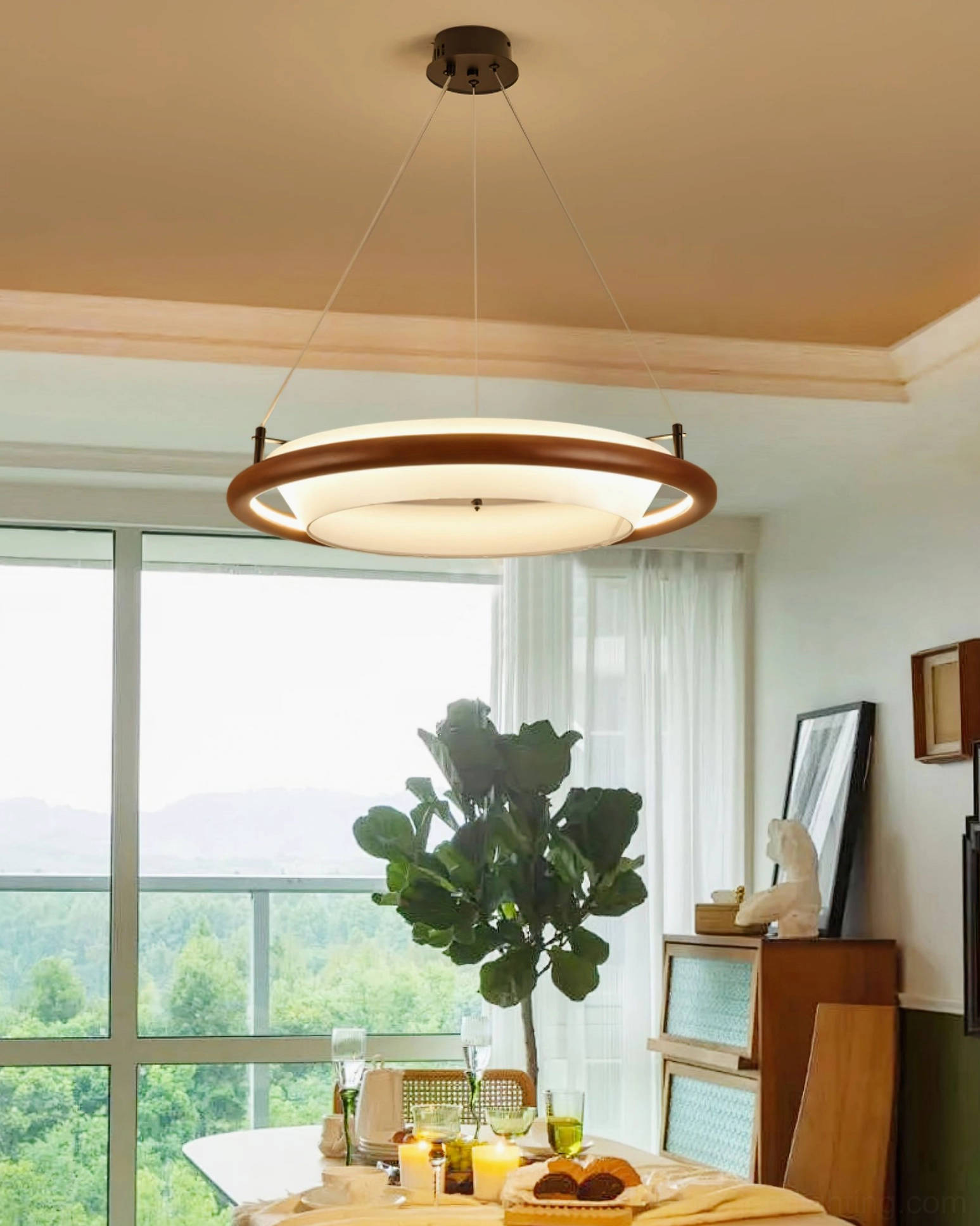 Natural wood ring LED pendant in sunlit dining area - wide interior shot with floor-to-ceiling windows and warm light diffusion