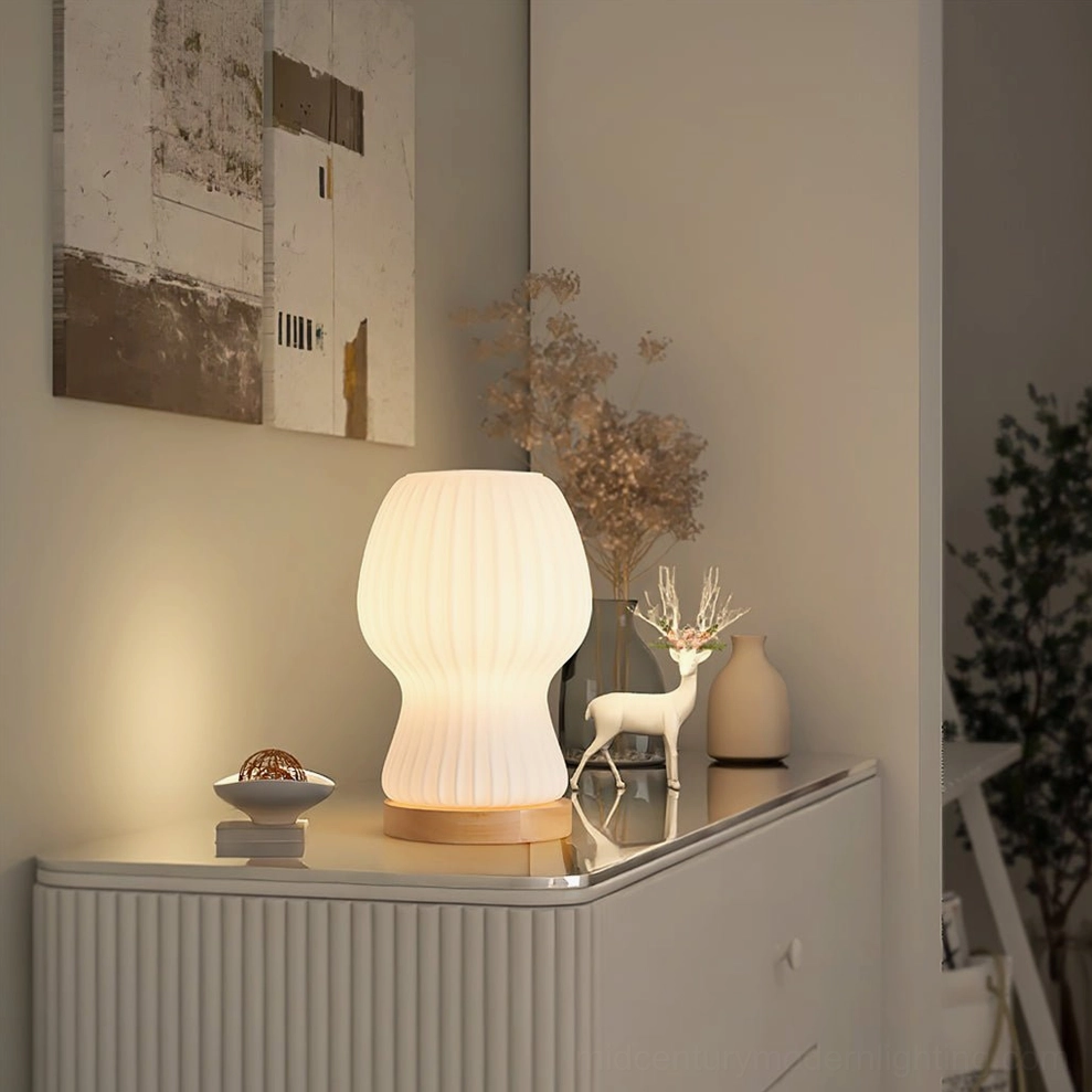 Baja table lamp on bedroom dresser with decorative ornaments and accessories