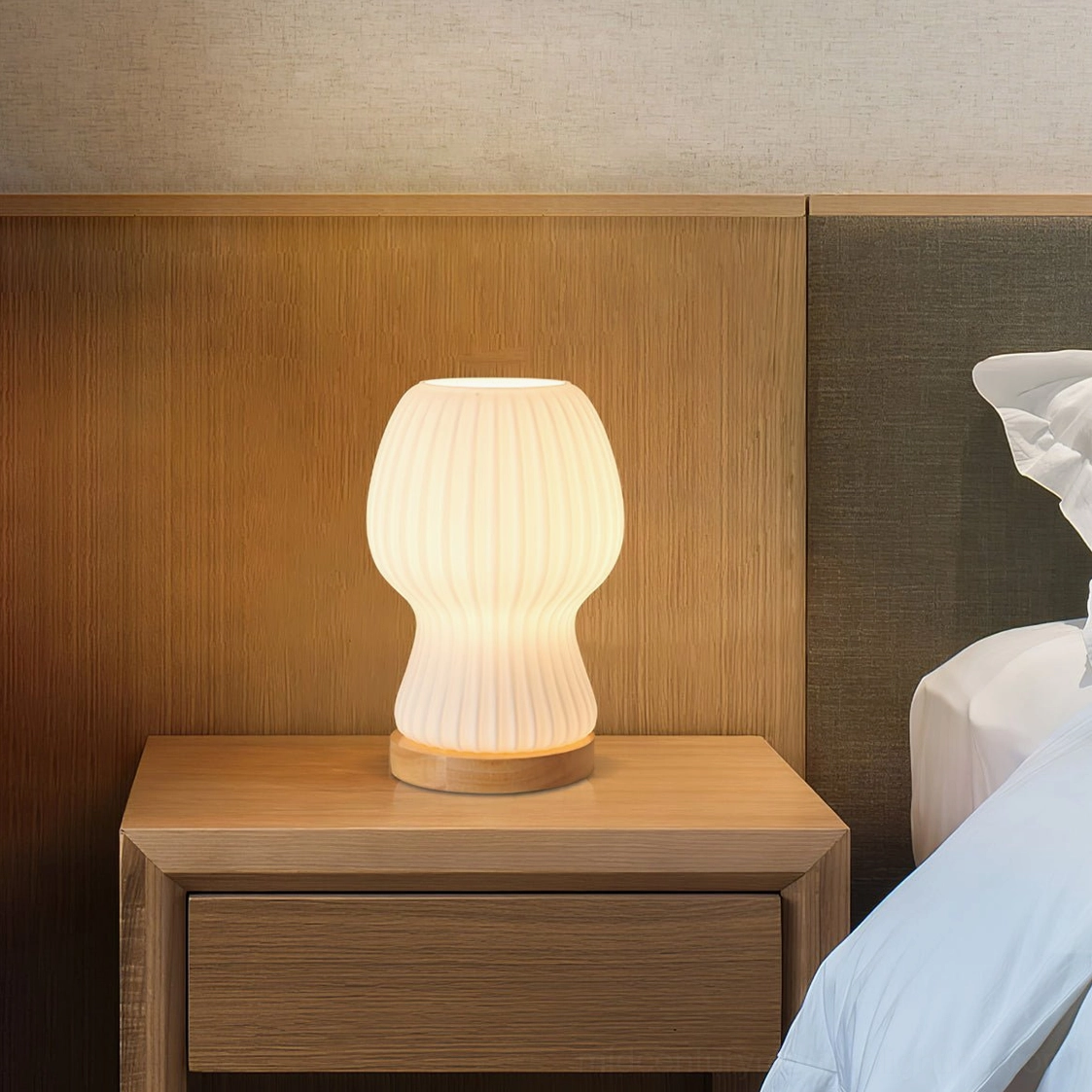 Baja table lamp with wooden headboard bedside arrangement, warm neutral home style