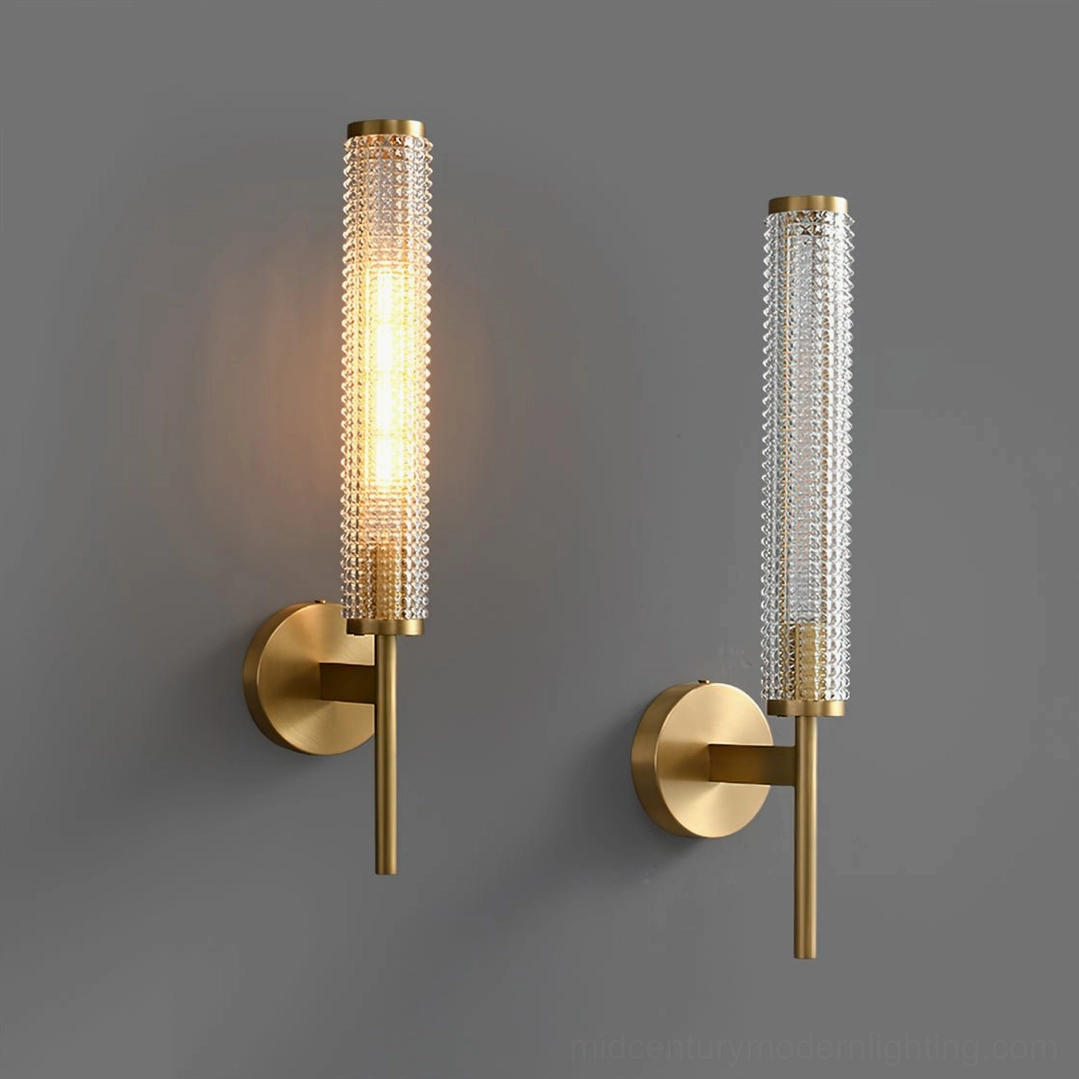 Baldassare cylindrical wall sconce with brass backplate mounting
