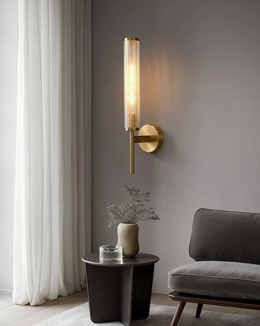 Baldassare wall sconce in minimalist modern living area with natural light