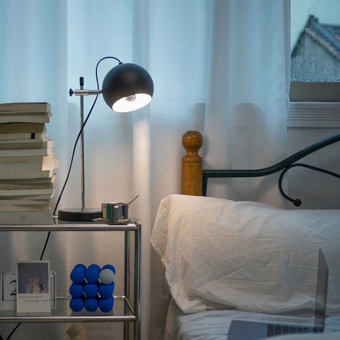 Modern ball bracket table lamp with clean geometric design on contemporary office desk