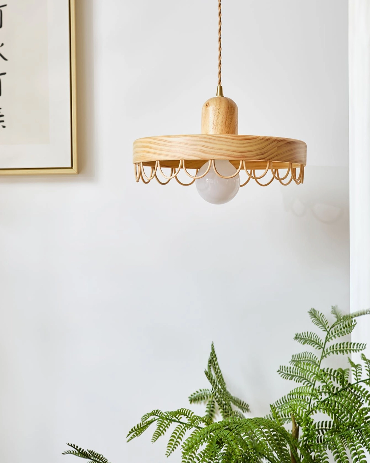 Balton wooden pendant light hanging side view, minimalist japandi style with scalloped trim, framed art wall