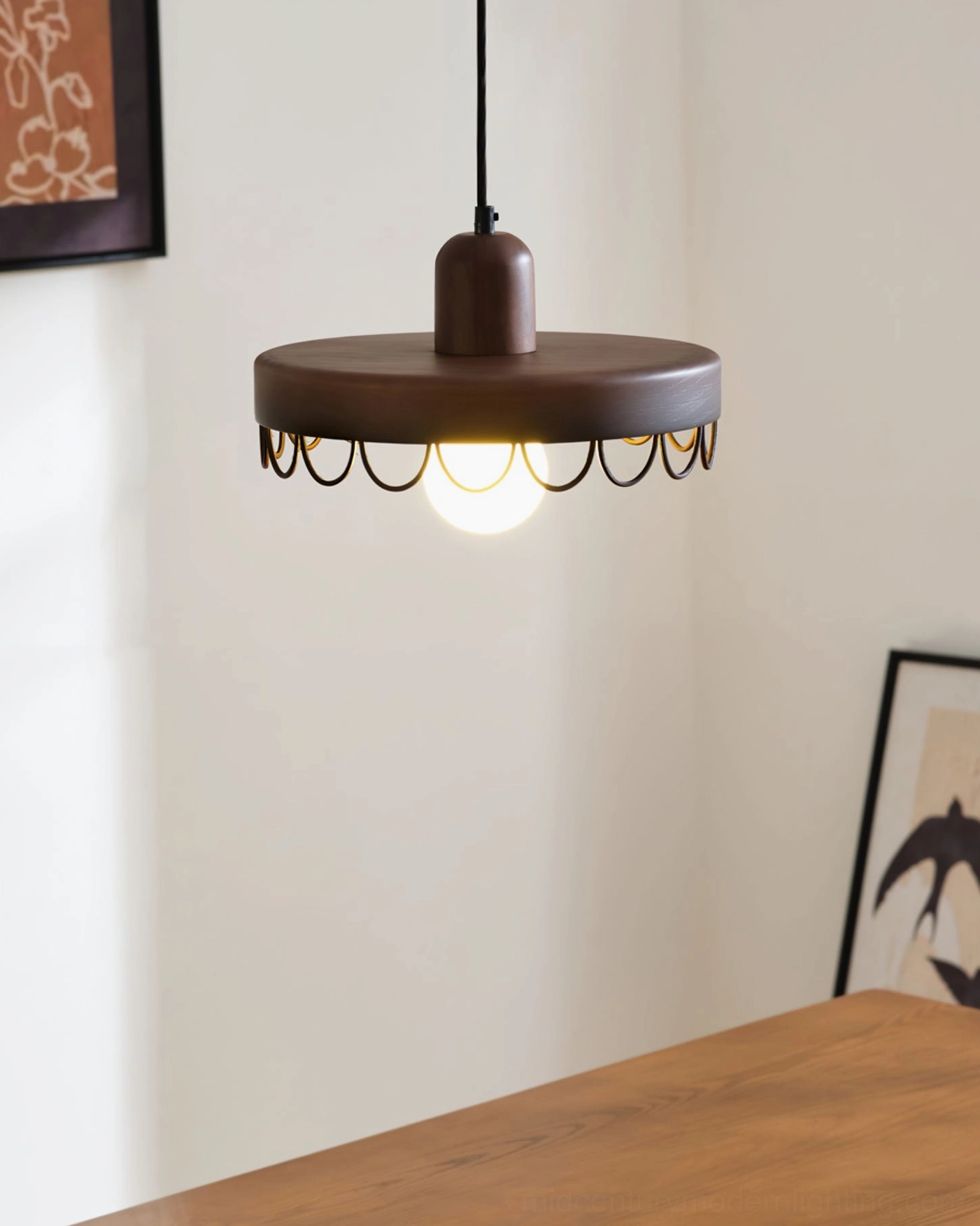 Dark walnut Balton pendant lamp bottom view with exposed warm glowing bulb, dining table corner setting