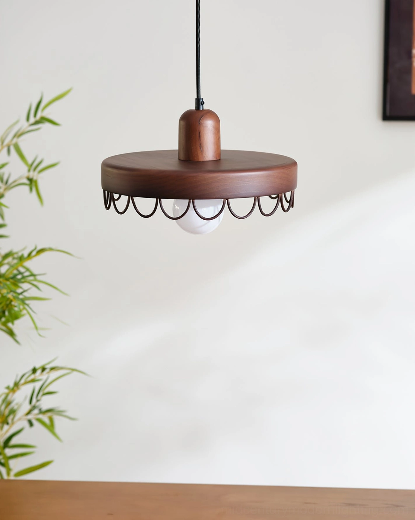 Dark walnut Balton pendant light bottom overhead view with black scalloped metal trim, matte wood finish in dining area