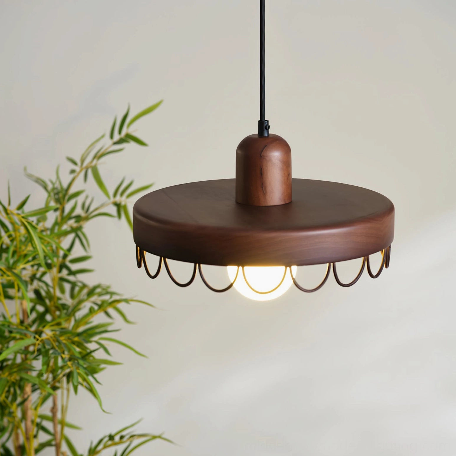 Balton pendant light bottom overhead view showing wood base and scalloped metal trim detail, bamboo greenery background
