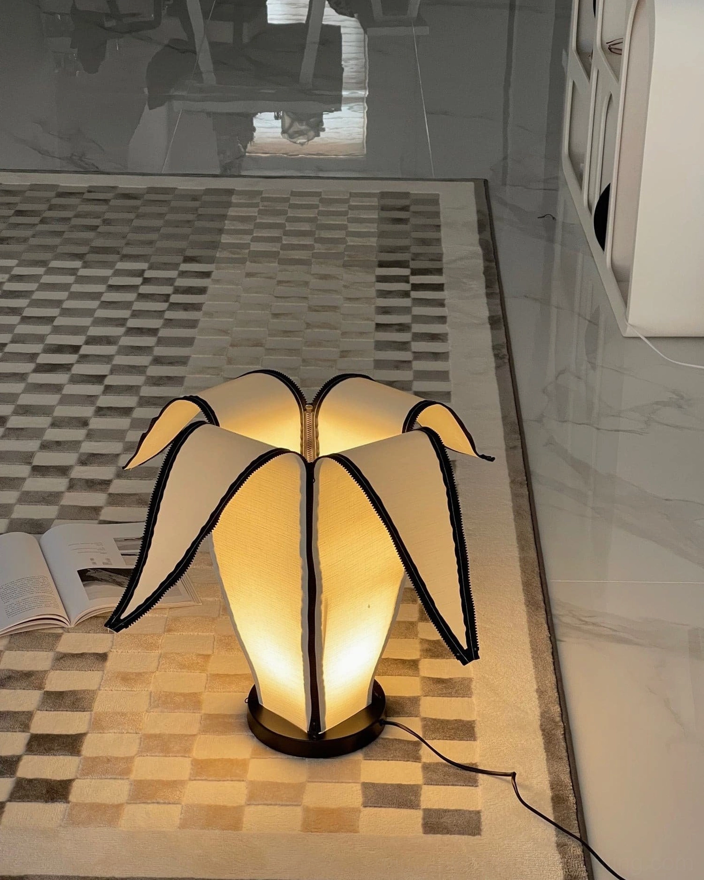Architectural banana table lamp showcasing organic form and playful minimalist design philosophy