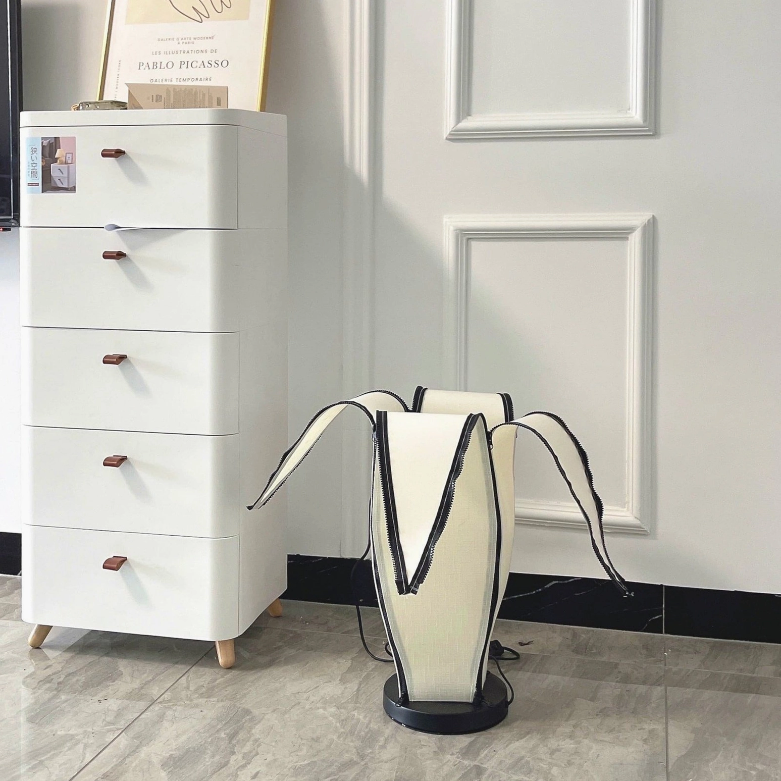 Banana table lamp on console table adding character to modern minimalist living room design