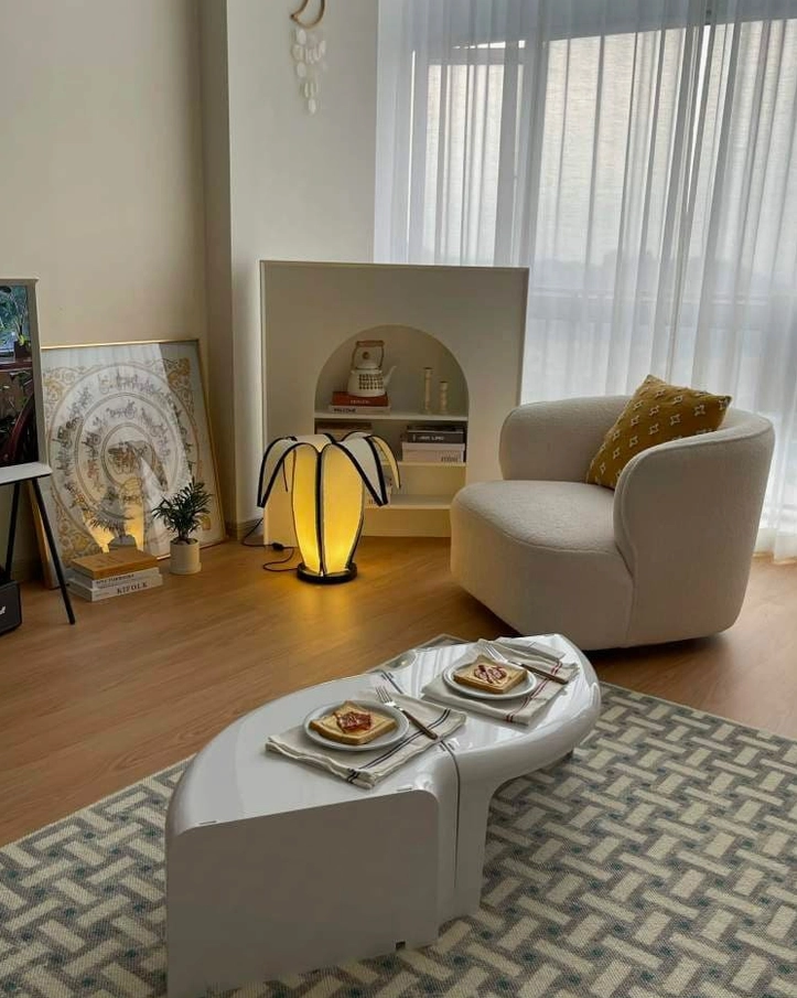 Banana table lamp providing task and ambient lighting in flexible home workspace environment