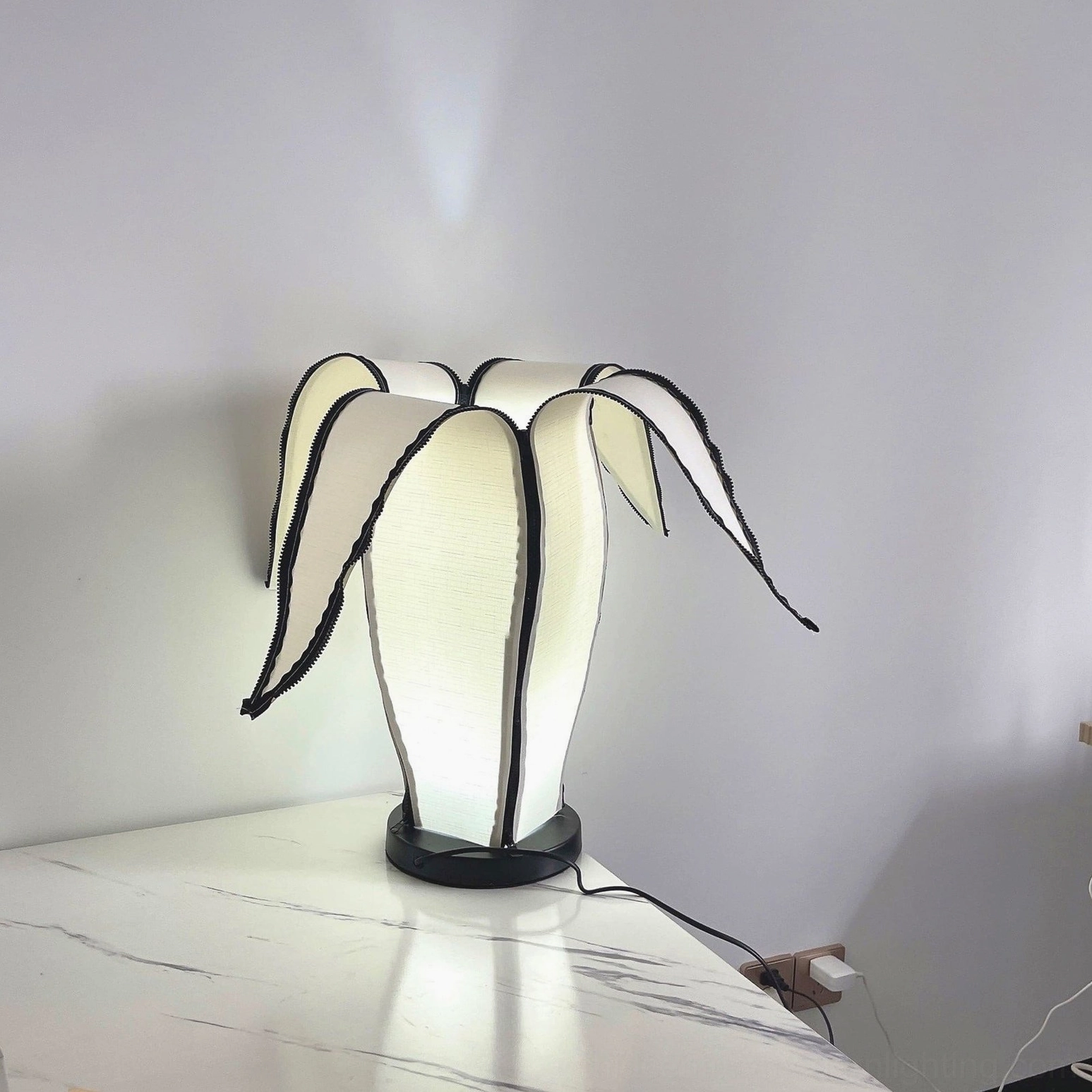 Banana table lamp pairing beautifully with geometric rugs and curated home accessories