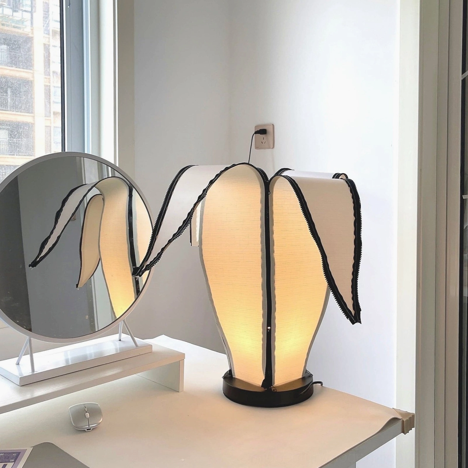 Interactive zip-down banana table lamp shade for adjustable light diffusion and ambiance control