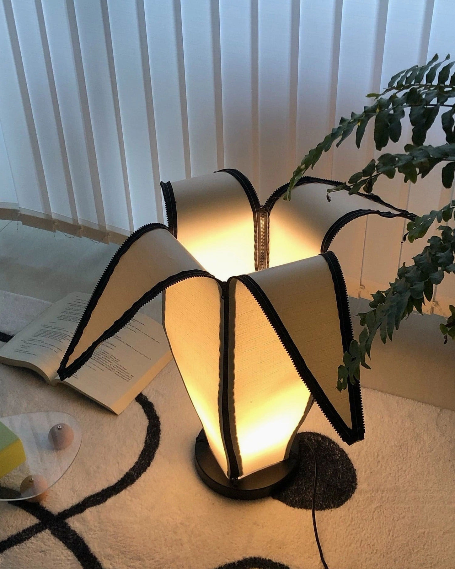 Banana table lamp demonstrating zip-down mechanism for personalized light customization