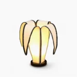 Banana table lamp with adjustable fabric shade and black edge trims, front view on white background