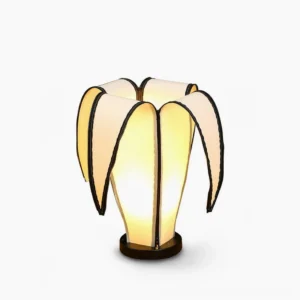 Banana table lamp with adjustable fabric shade and black edge trims, front view on white background
