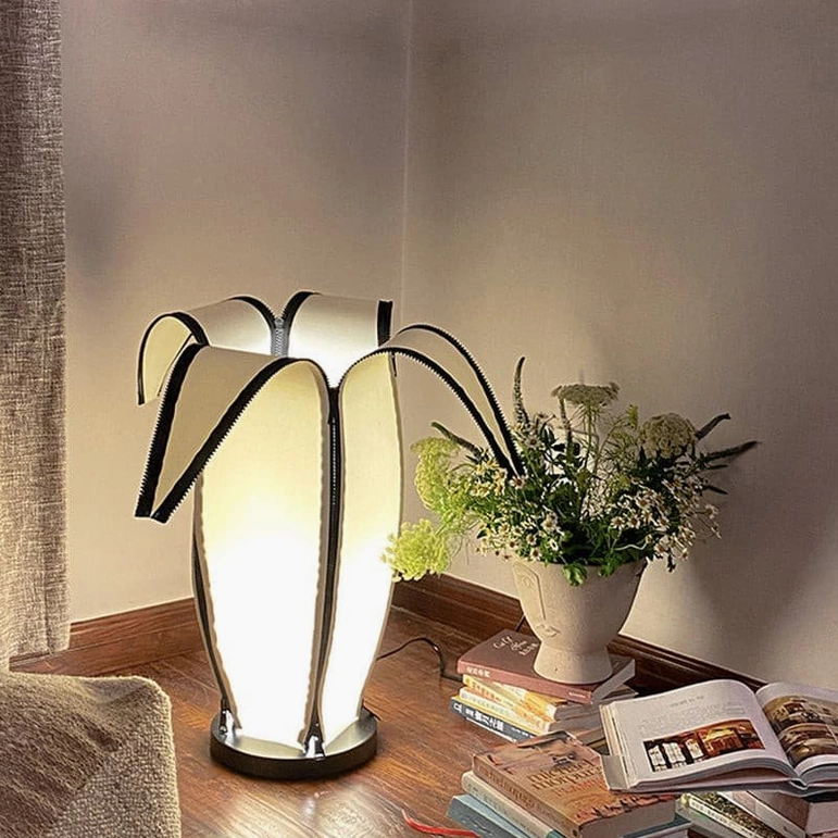Contemporary banana table lamp illuminating minimalist home office workspace and decor