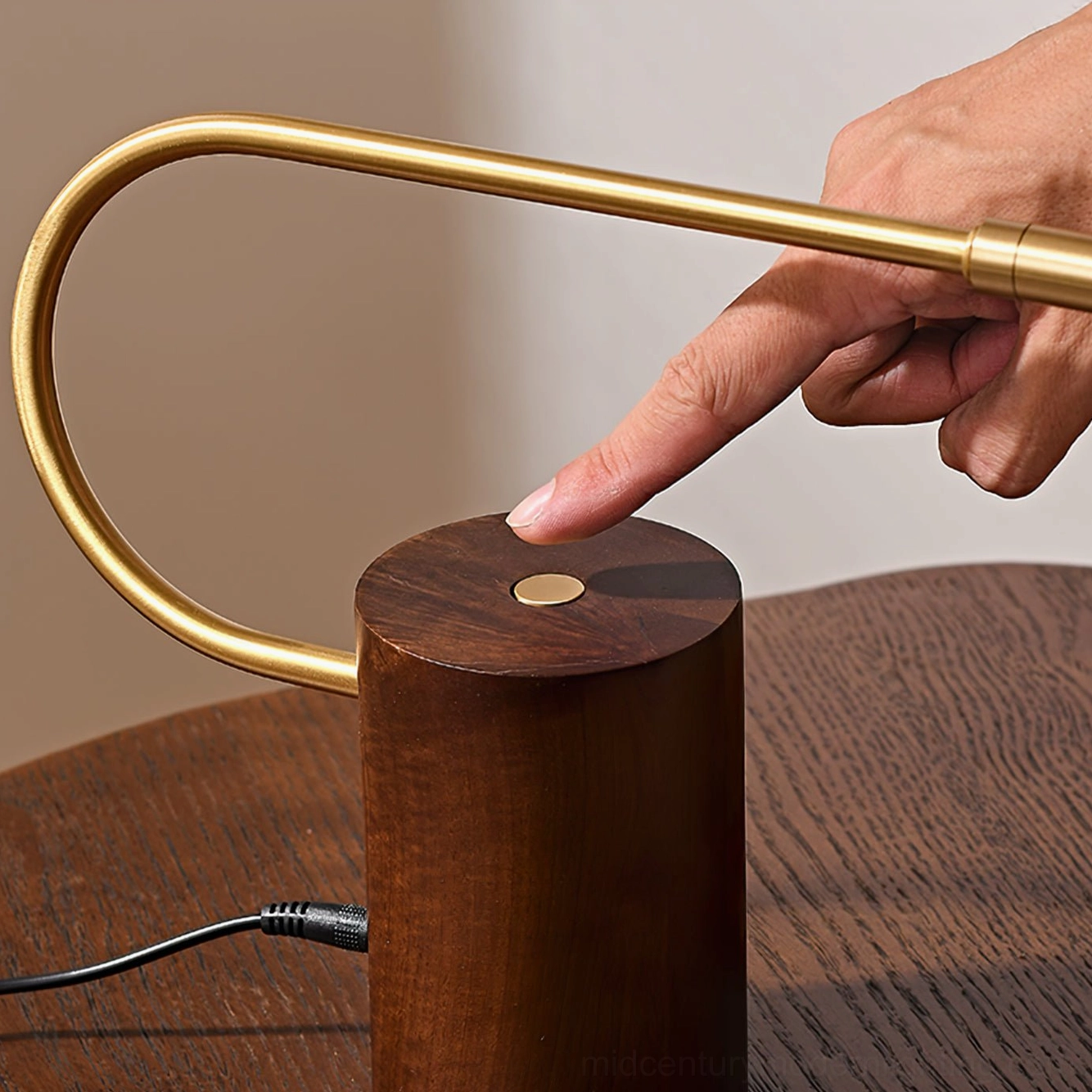 Close-up overhead view of Banker Slim lamp showing touch control switch on walnut base