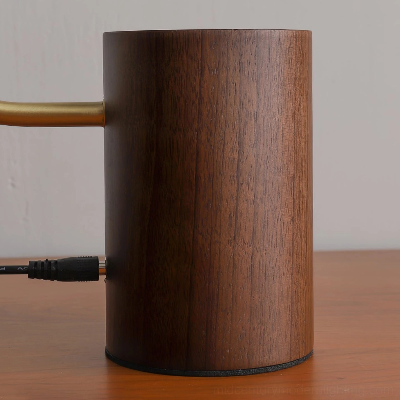 Walnut wood base of Banker Slim lamp front close-up showing wood grain and USB charging port