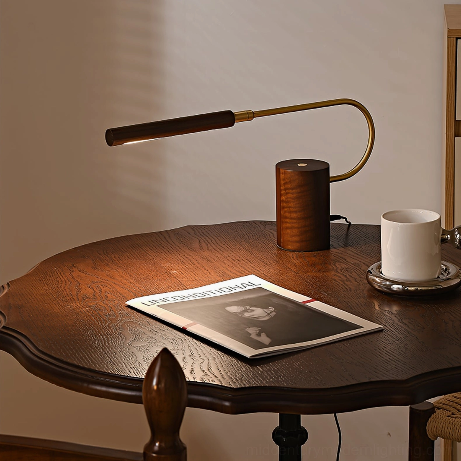 Banker Slim modern desk lamp on vintage round table with magazine and coffee cup styling
