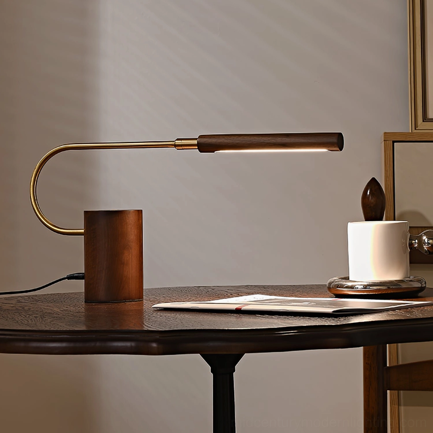 Banker Slim desk lamp illuminating vintage workspace with coffee cup and book, eye-level dining table view