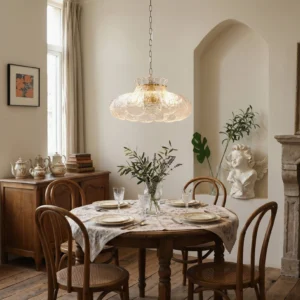 Barlas pendant light installed in vintage dining room above dining set, warm ambient lighting illuminating arched wall niche and wooden furniture