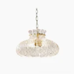 Barlas ribbed glass pendant light with scalloped pumpkin silhouette, studio overhead view showing textured glass detail and gold metalwork