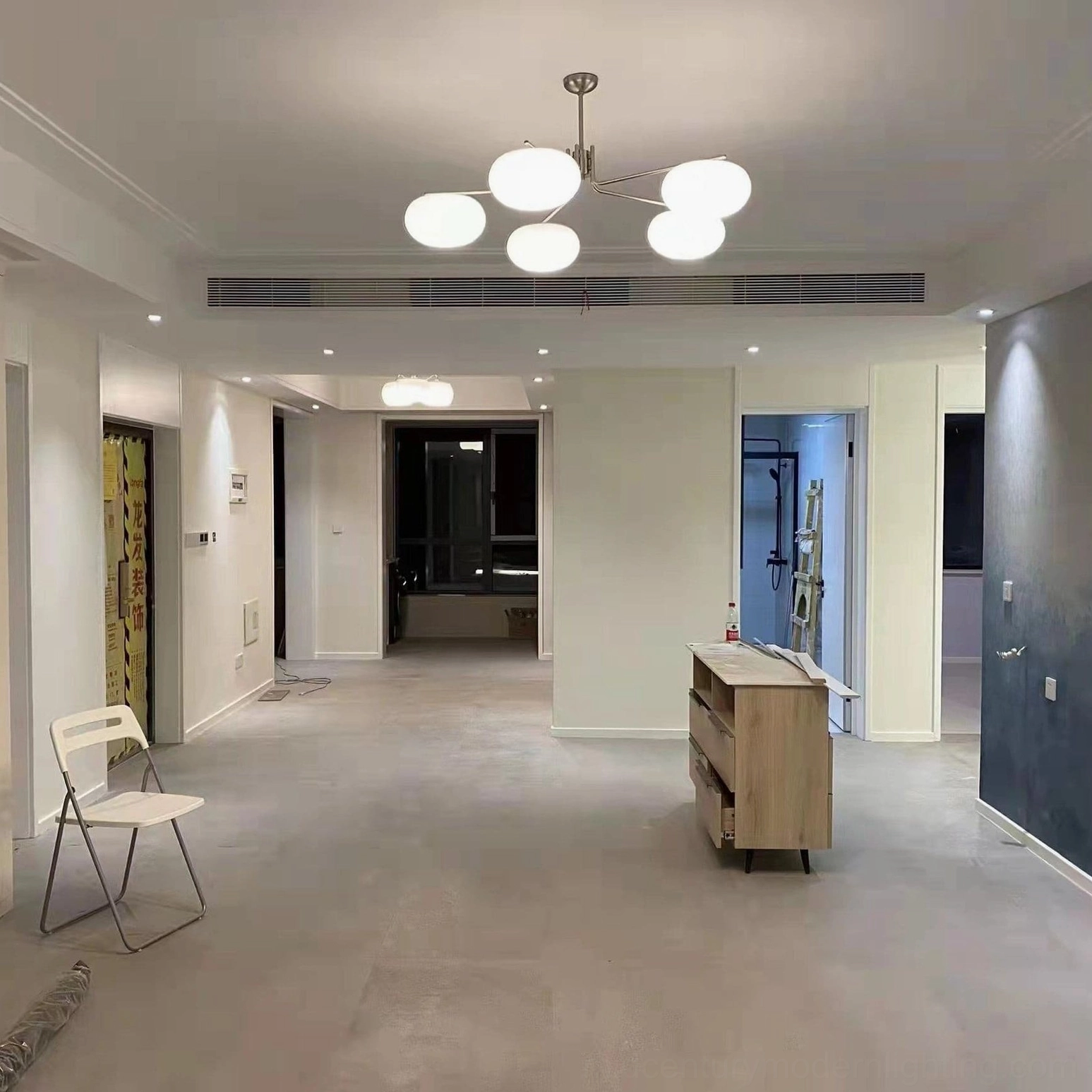 Barndon mid-century modern pendant light in hallway with 5-head frosted glass design, eye-level perspective showing modern minimalist style