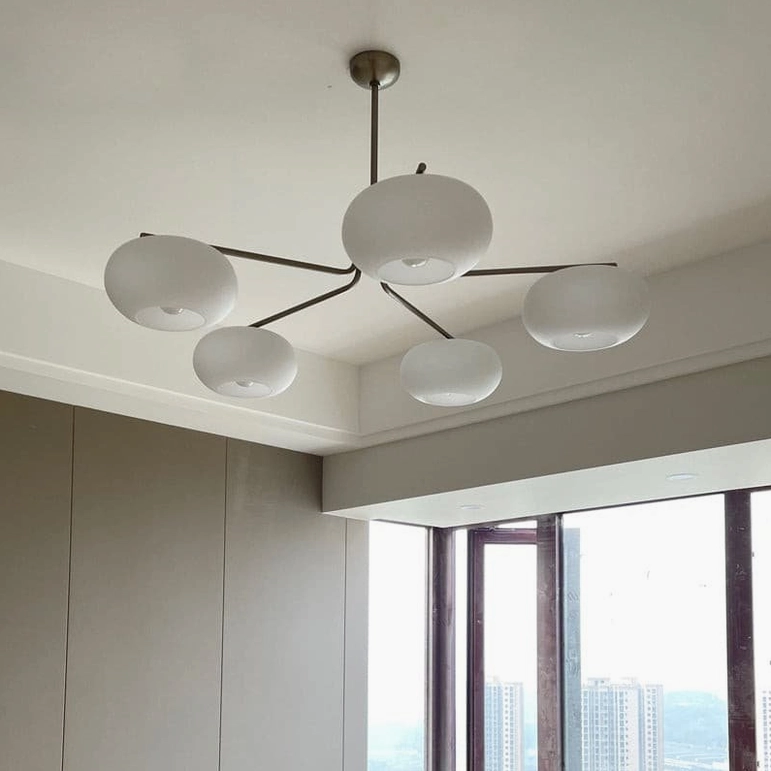 Barndon industrial glass chandelier creating ambient lighting effect in modern living space
