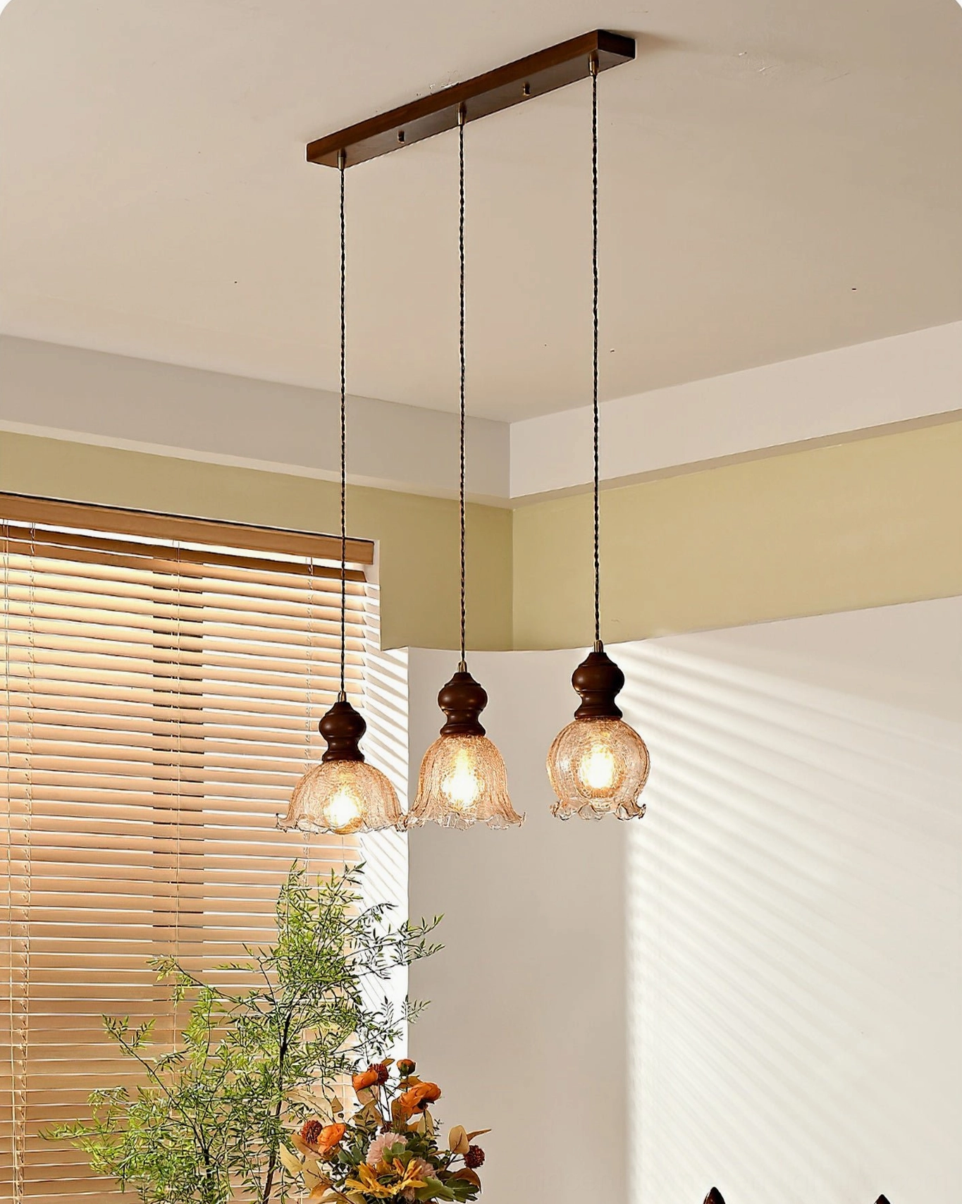 Barron pendant light fixture detail showing walnut wood accents and amber glass construction