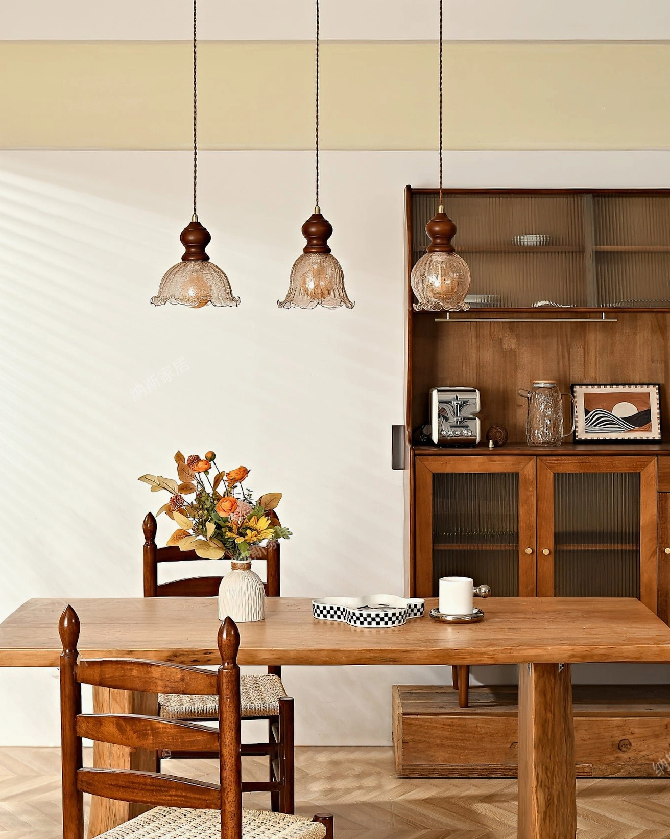 Three Barron pendant lights in formal dining room with display cabinet and decorative tableware