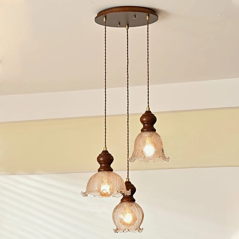 Three Barron pendant lights on round canopy, dining room arrangement with warm ambiance