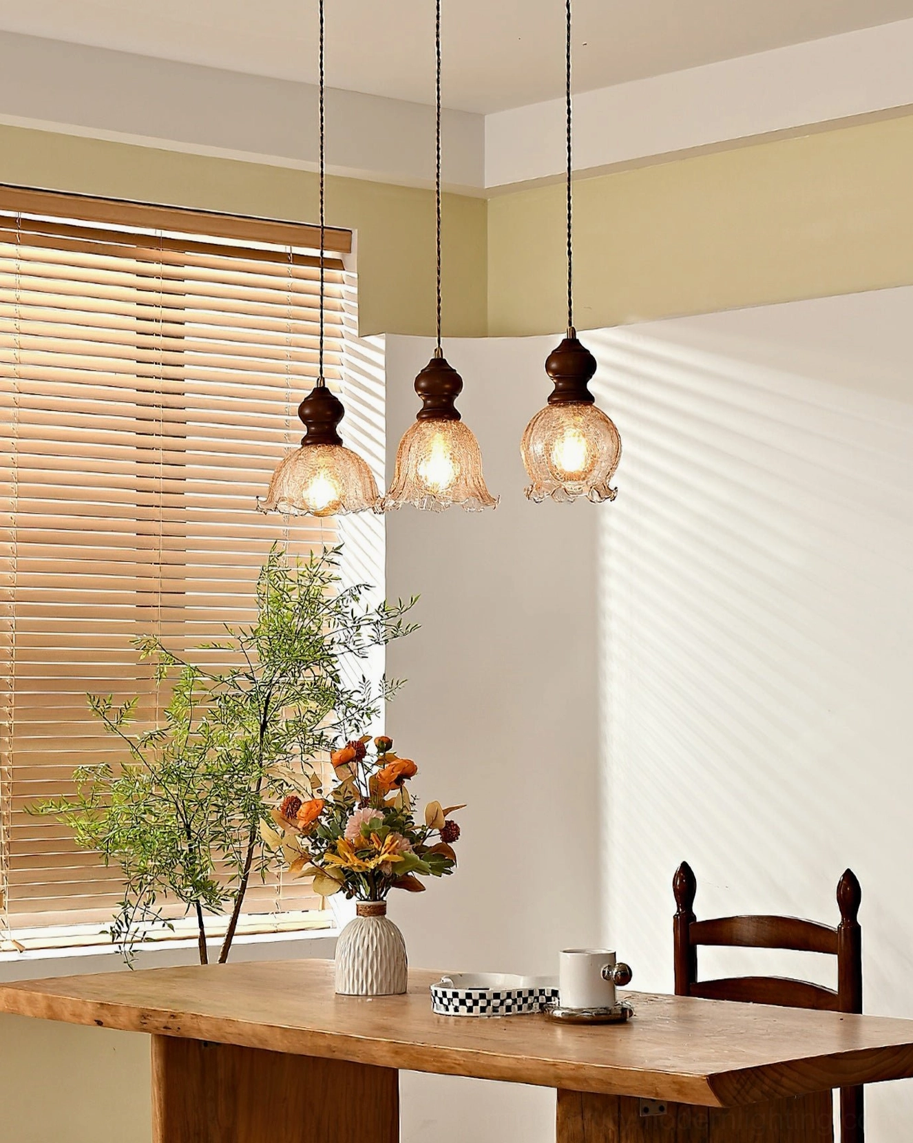 Triple Barron pendant fixtures in cozy dining space with wooden blinds, rustic retro ambiance