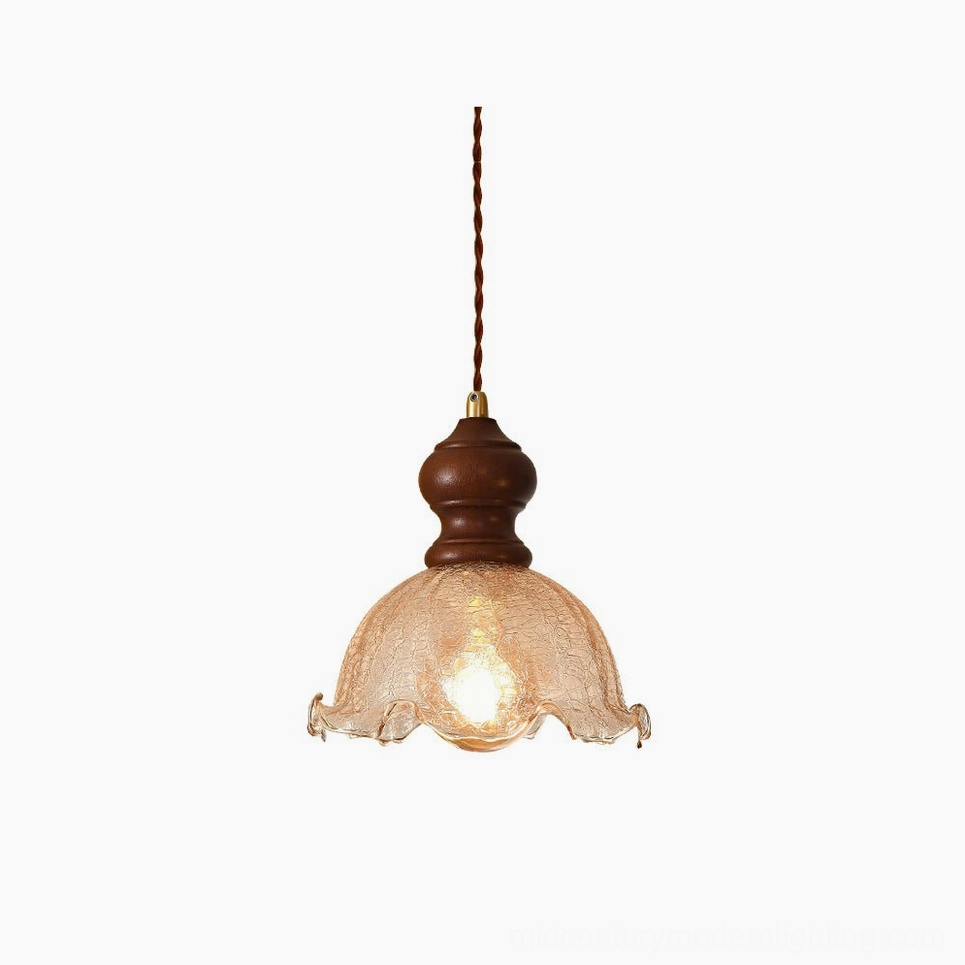 Barron pendant light single walnut wood fixture with textured amber glass shade, front studio view
