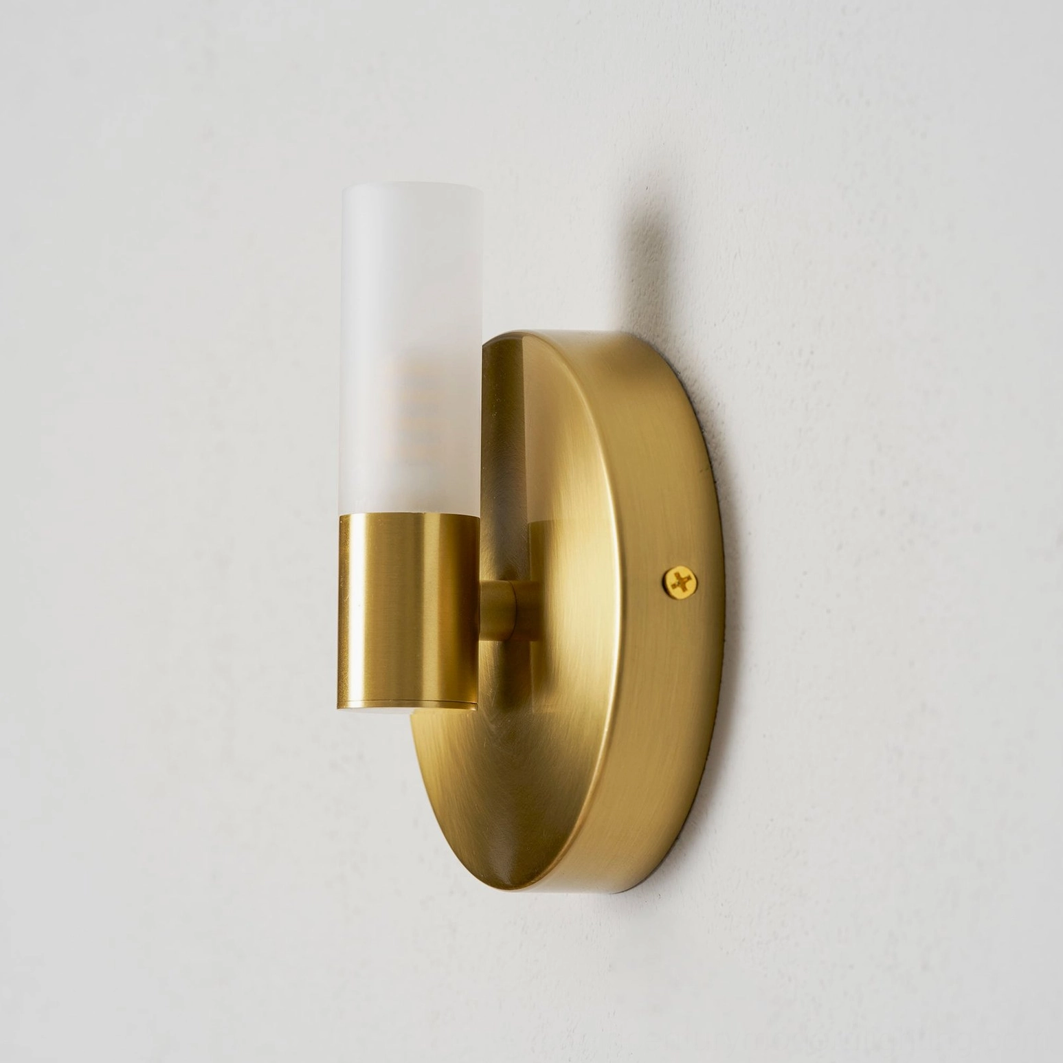 Barton wall sconce in contemporary bedroom, compact size paired bedside lighting