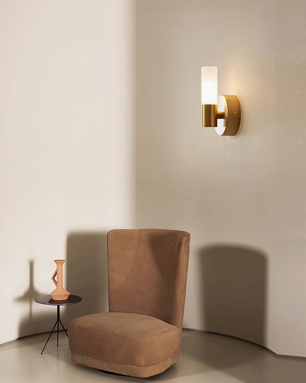 Barton wall sconce close-up, polished brass backplate and frosted glass construction