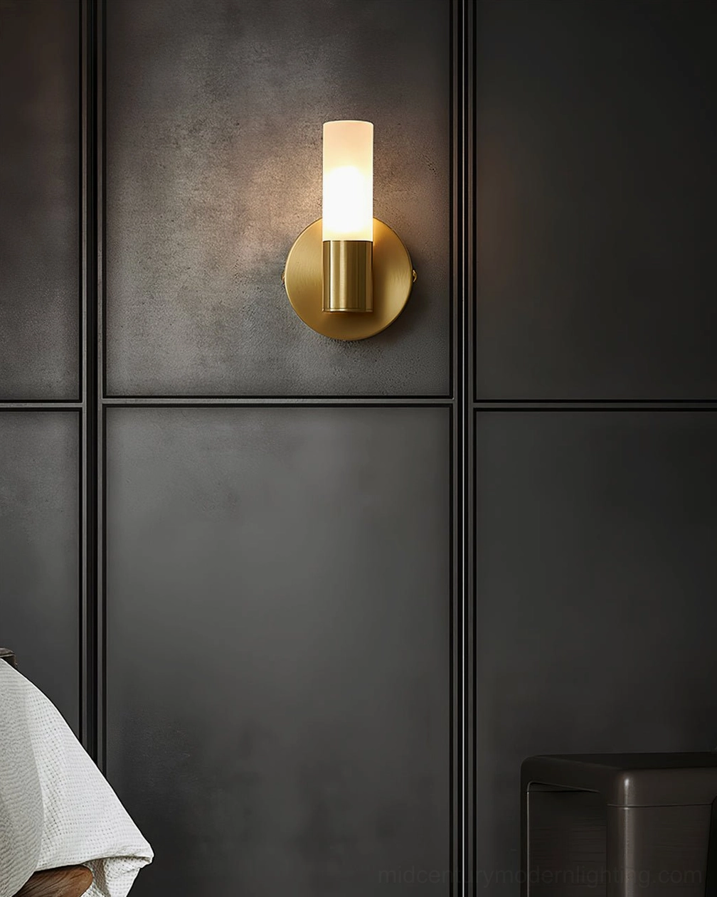 Barton wall sconce on dark paneled accent wall, sleek modern luxury lighting