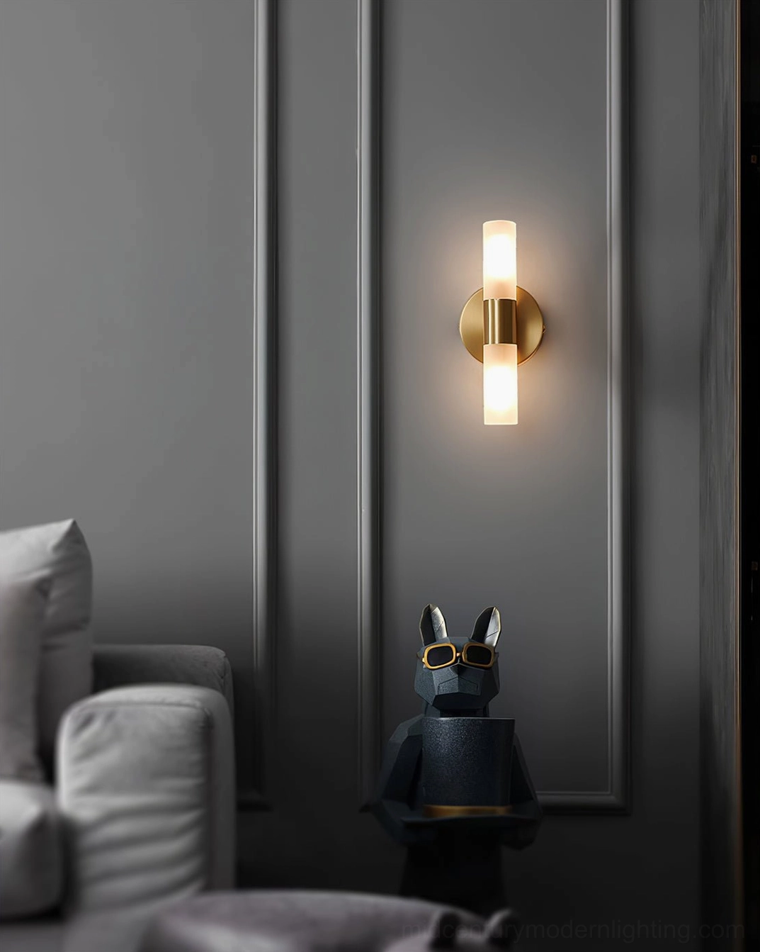 Barton wall sconce detail shot, frosted glass cylinder and brass band connection