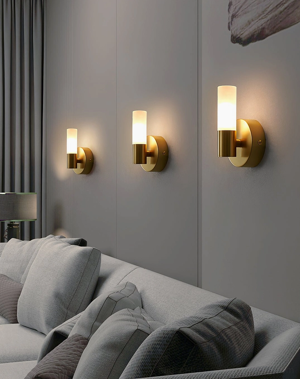 Set of three Barton wall sconces installed on modern sofa feature wall