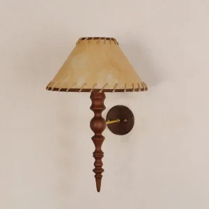 Basica wooden wall lamp close-up showing stitched fabric shade detail and turned wood mounting pole