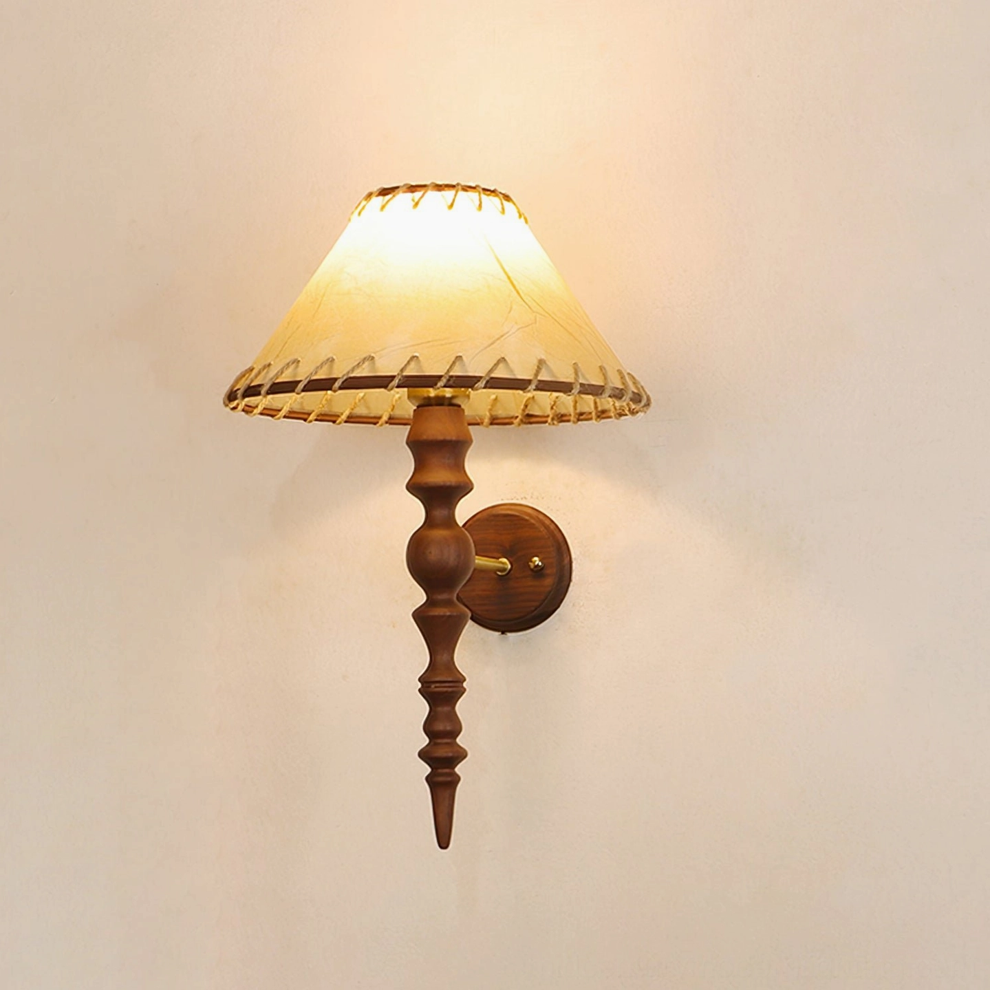 Basica illuminated wall lamp emitting warm ambient light on bedroom wall