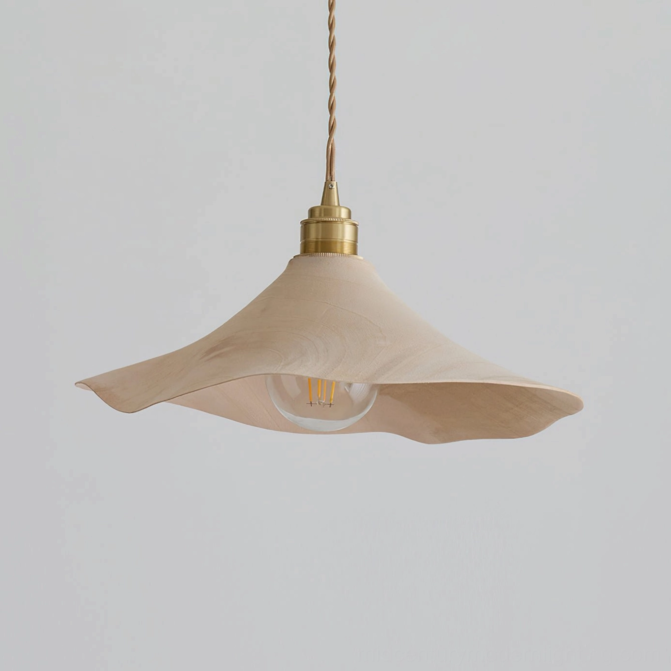 Baxter wabi-sabi pendant light showing sculptural form and light diffusion creating soft ambient glow in indoor space
