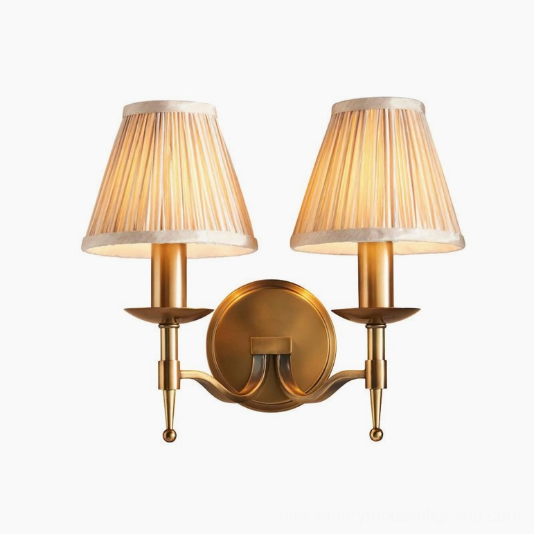Extended configuration Baylor brass wall sconce with longer arm projection for larger wall surfaces and sofa flanking
