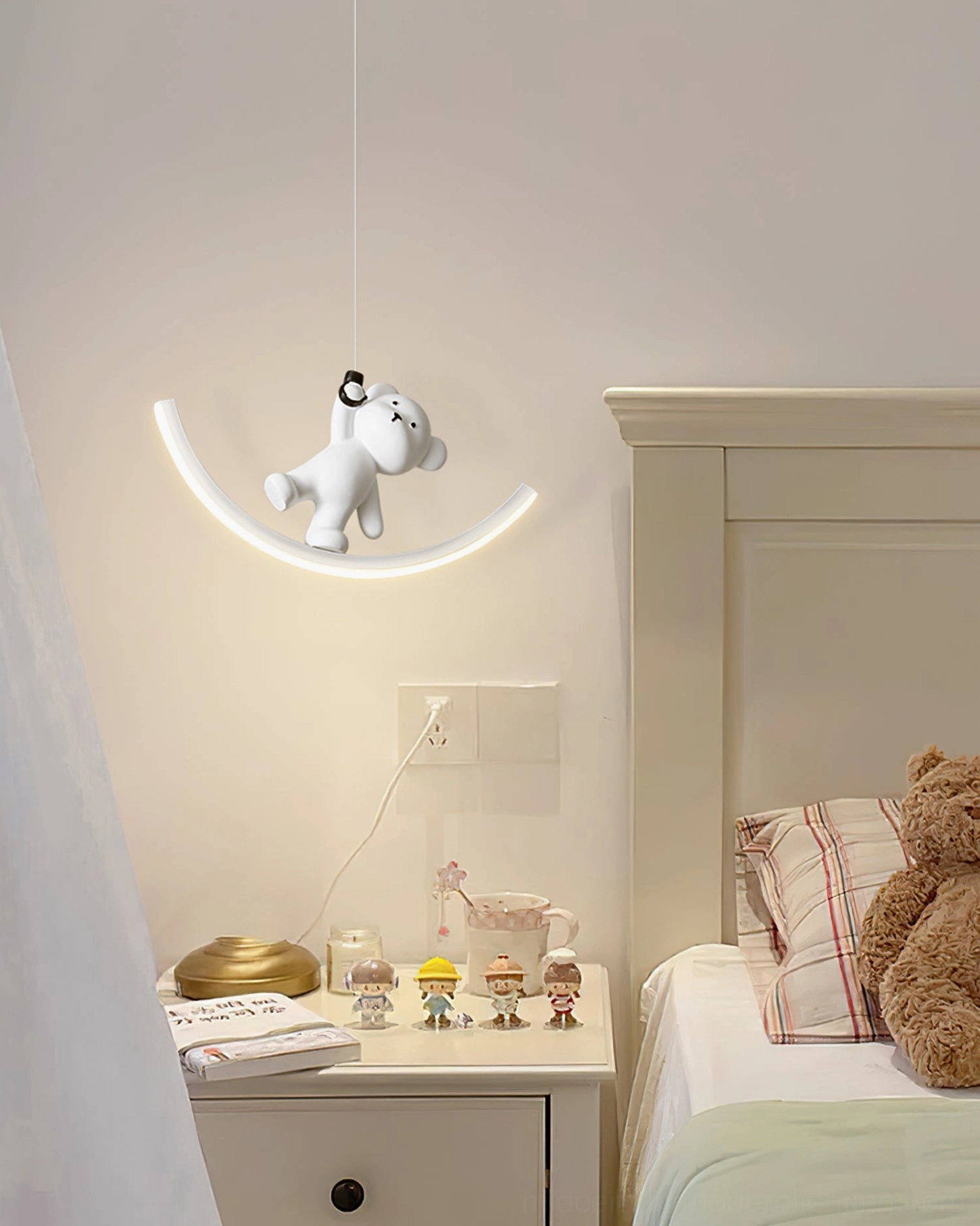 Modern bear pendant light suspended in master bedroom - sculptural focal point above bed area