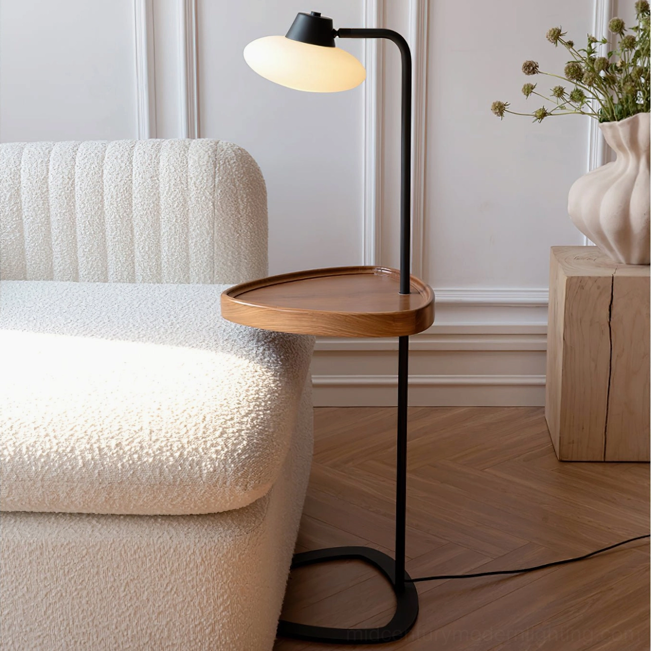 Beatrix floor lamp beside boucle sofa in cozy living room, warm neutral home décor, tray styled with decorative objects