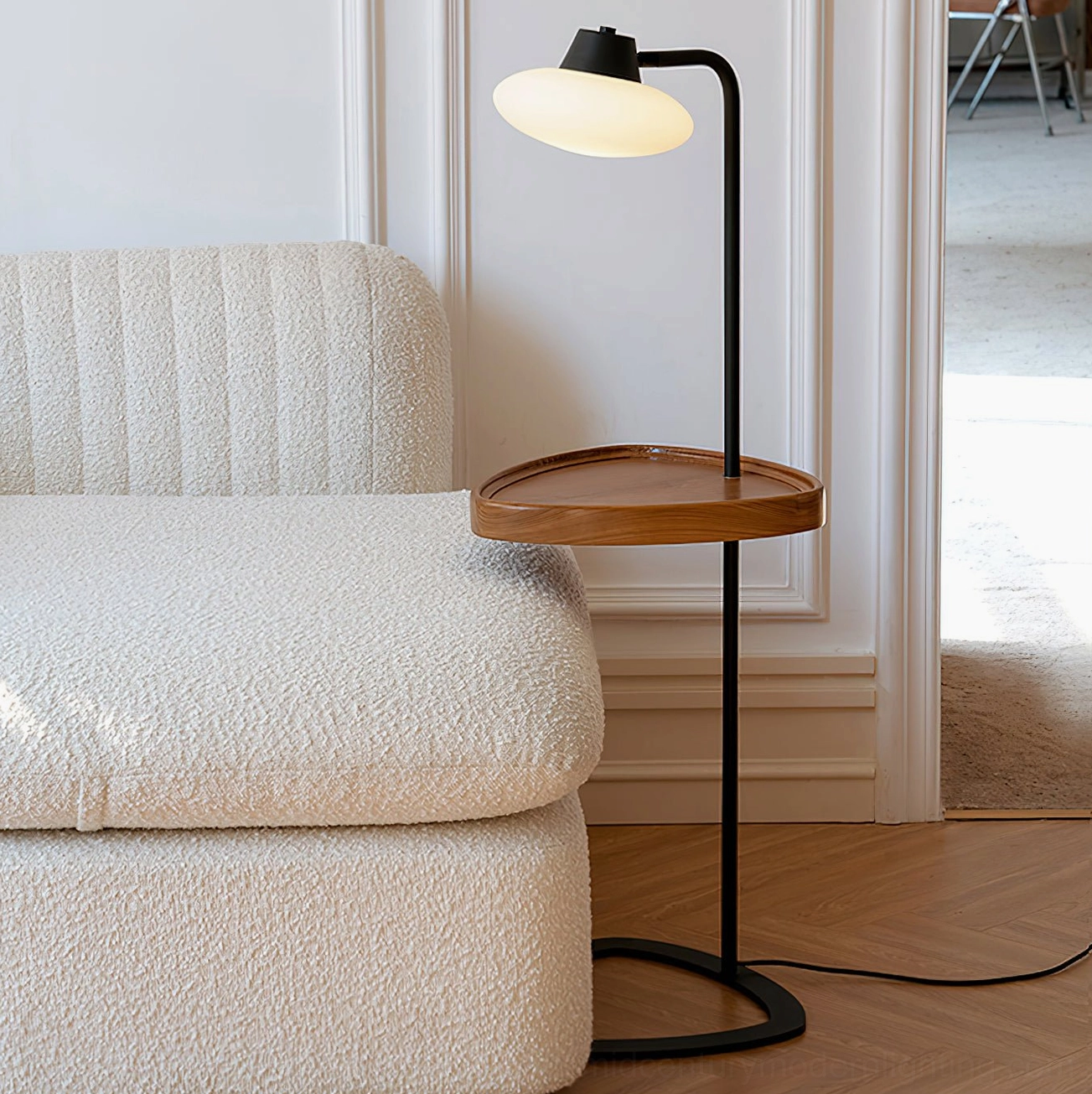 Beatrix side table floor lamp in minimalist living room corner, matte black metal hardware, mid-century modern design