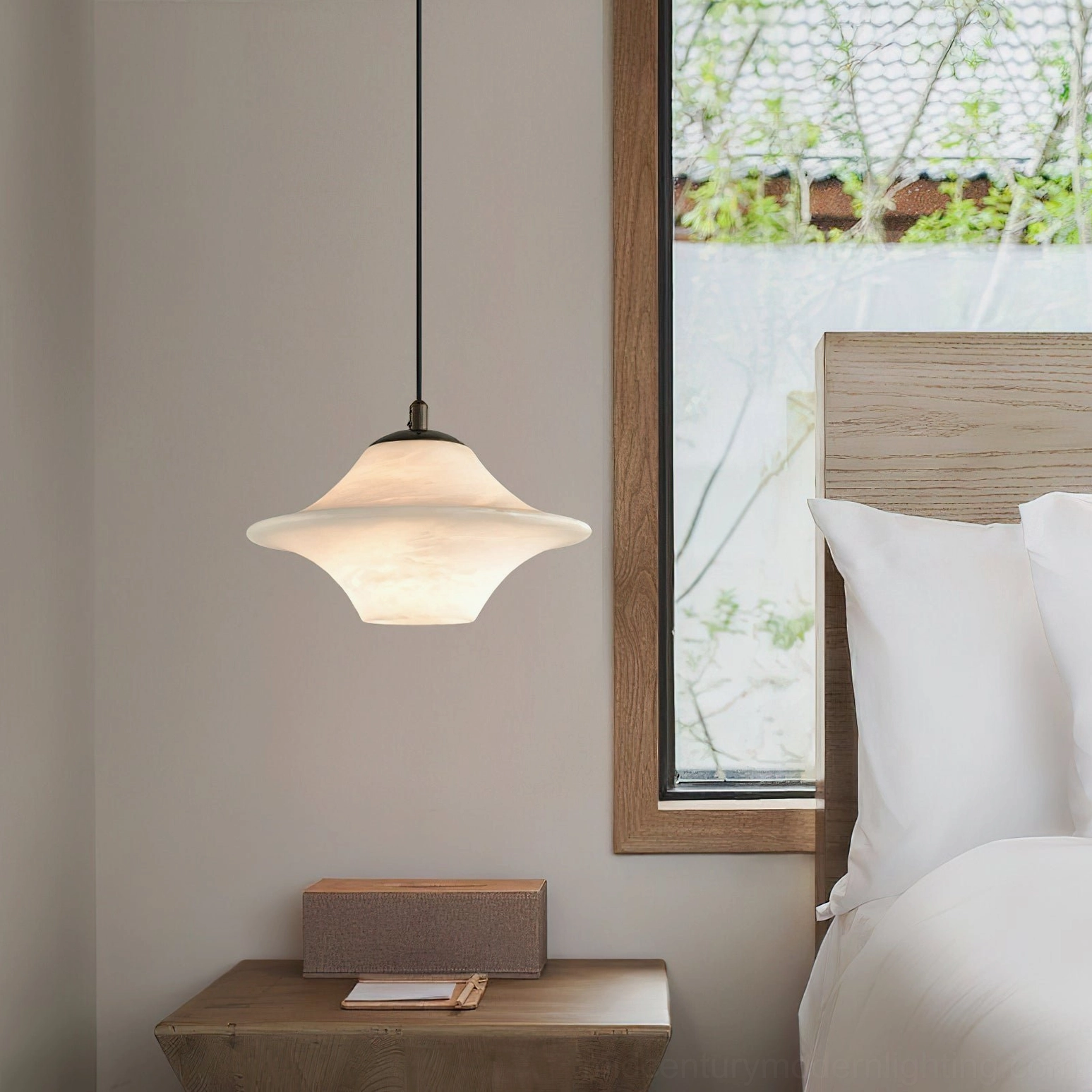 Beckett alabaster pendant light installed over bedroom bedside table - warm ambient lighting with mid-century modern bedroom decor