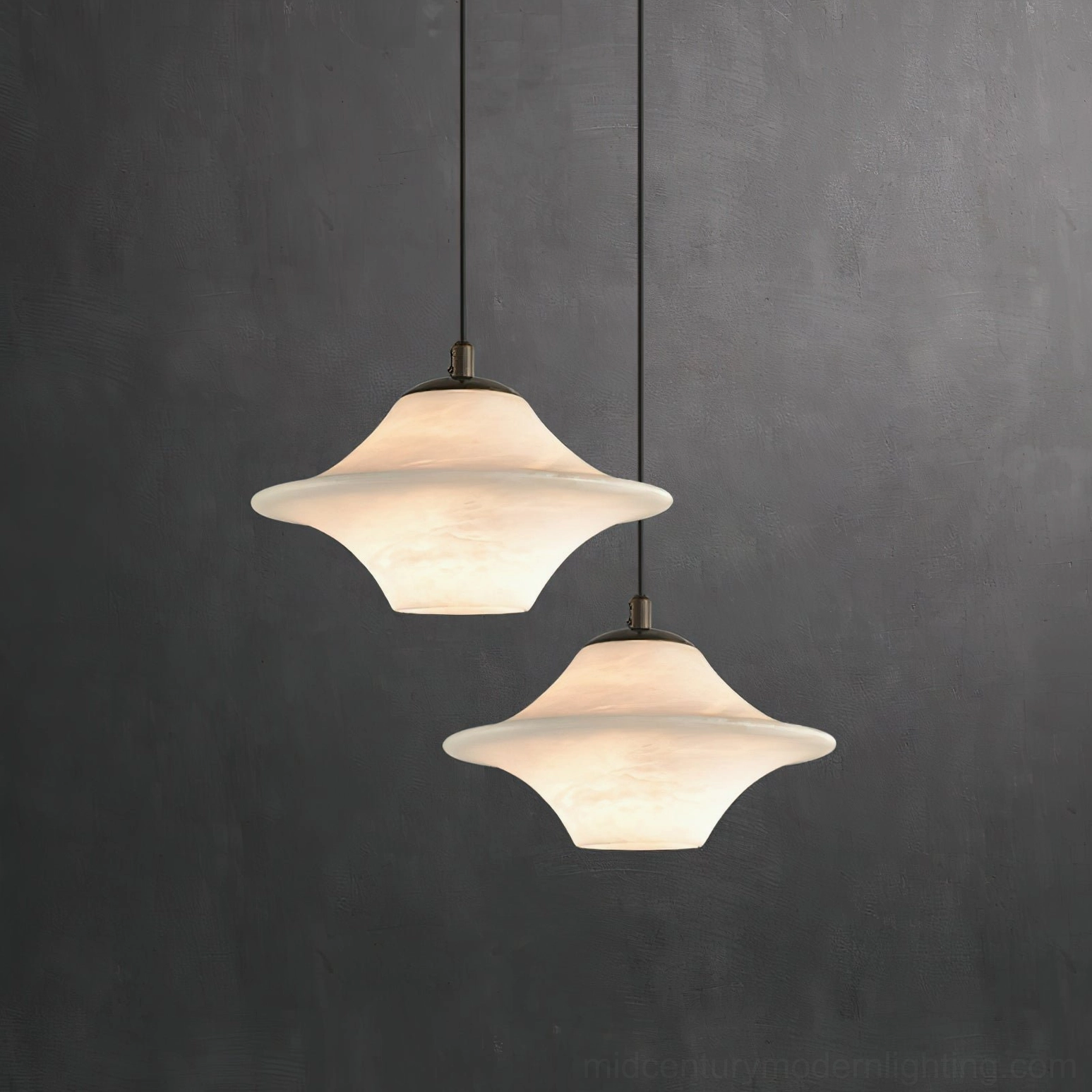 Dual Beckett alabaster pendant lights - matching pair in studio setting showing symmetrical sculptural design
