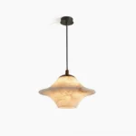 Beckett natural alabaster pendant light - direct frontal overhead studio view showing sculptural flared shade and translucent stone material