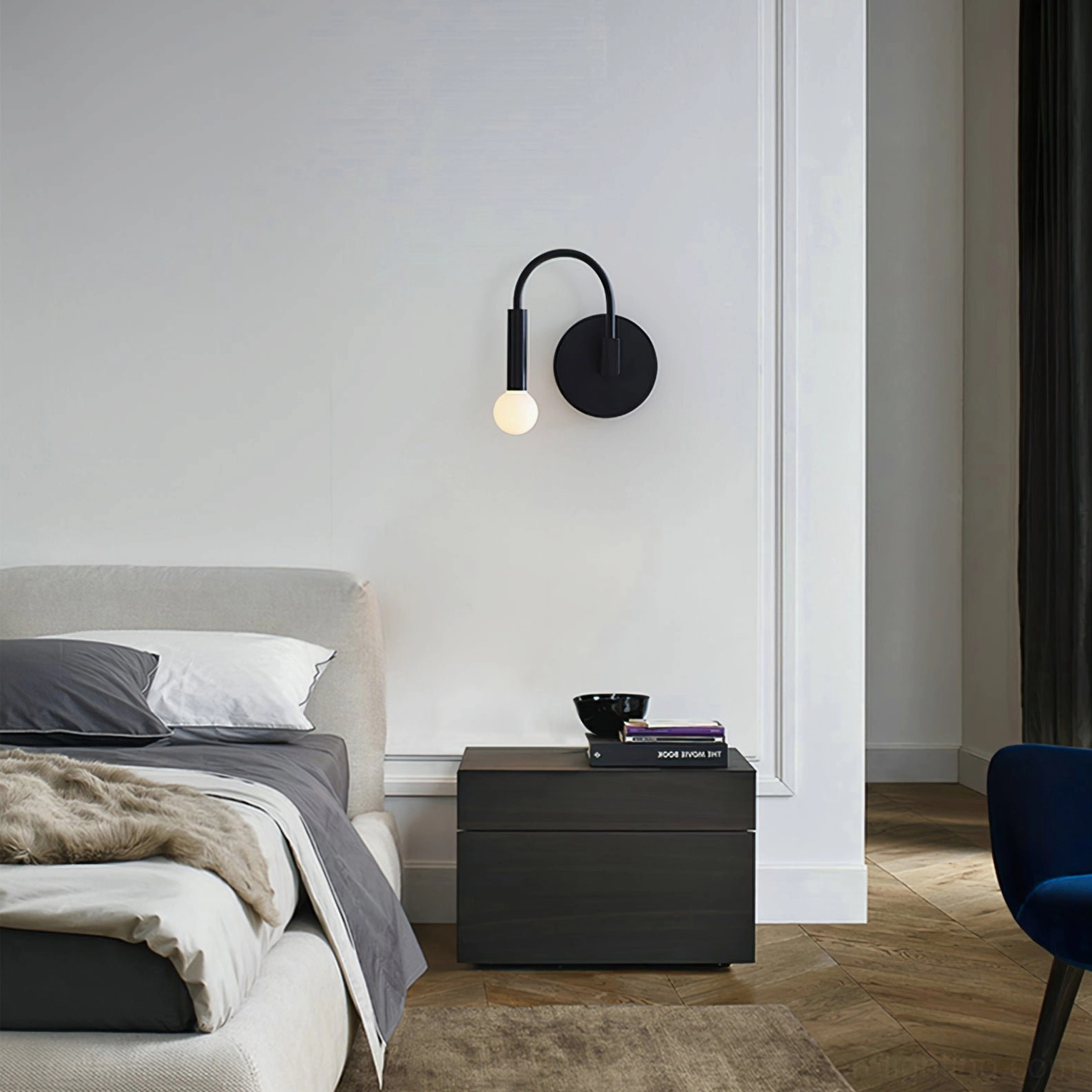 Bedroom ambient lighting with arch wall sconce mounted beside bedside table